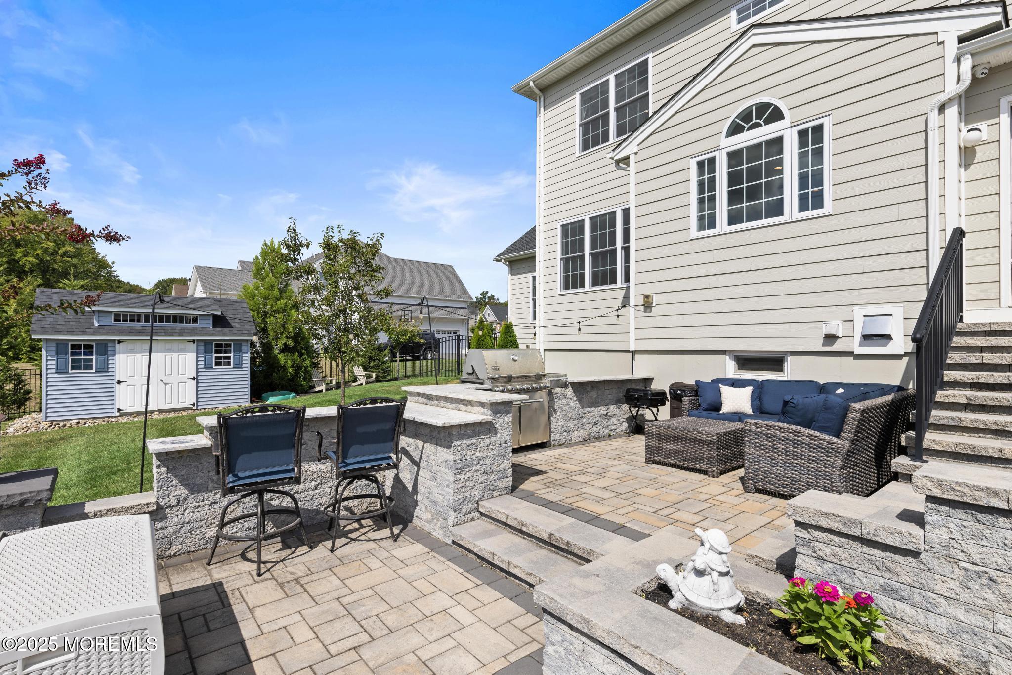 45 Windermere Road Lincroft, NJ 07738 - Photo 52 of 68 a view of a patio with couches table and chairs and potted plants