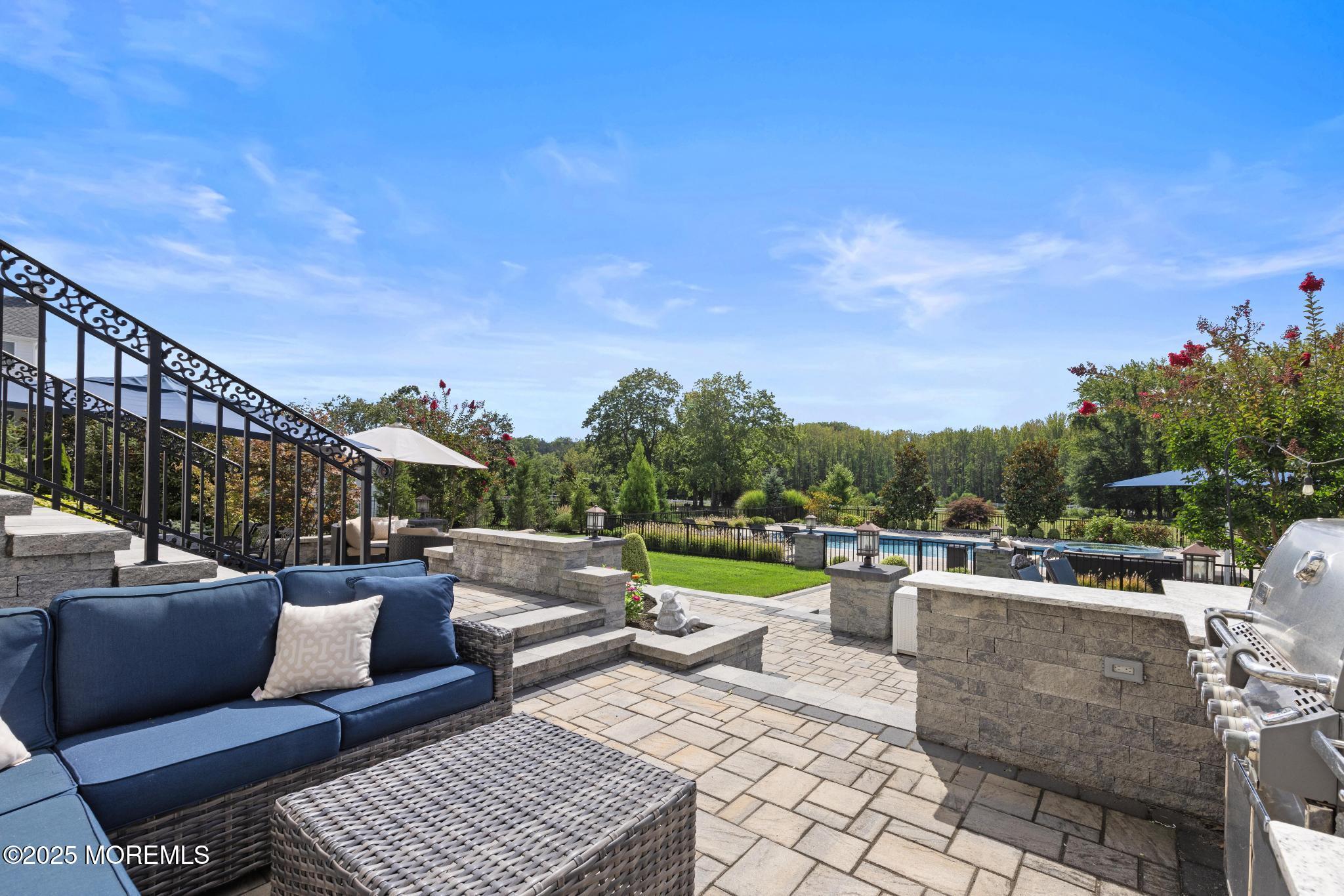 45 Windermere Road Lincroft, NJ 07738 - Photo 54 of 68 a view of a patio with couches chairs and a table and chairs