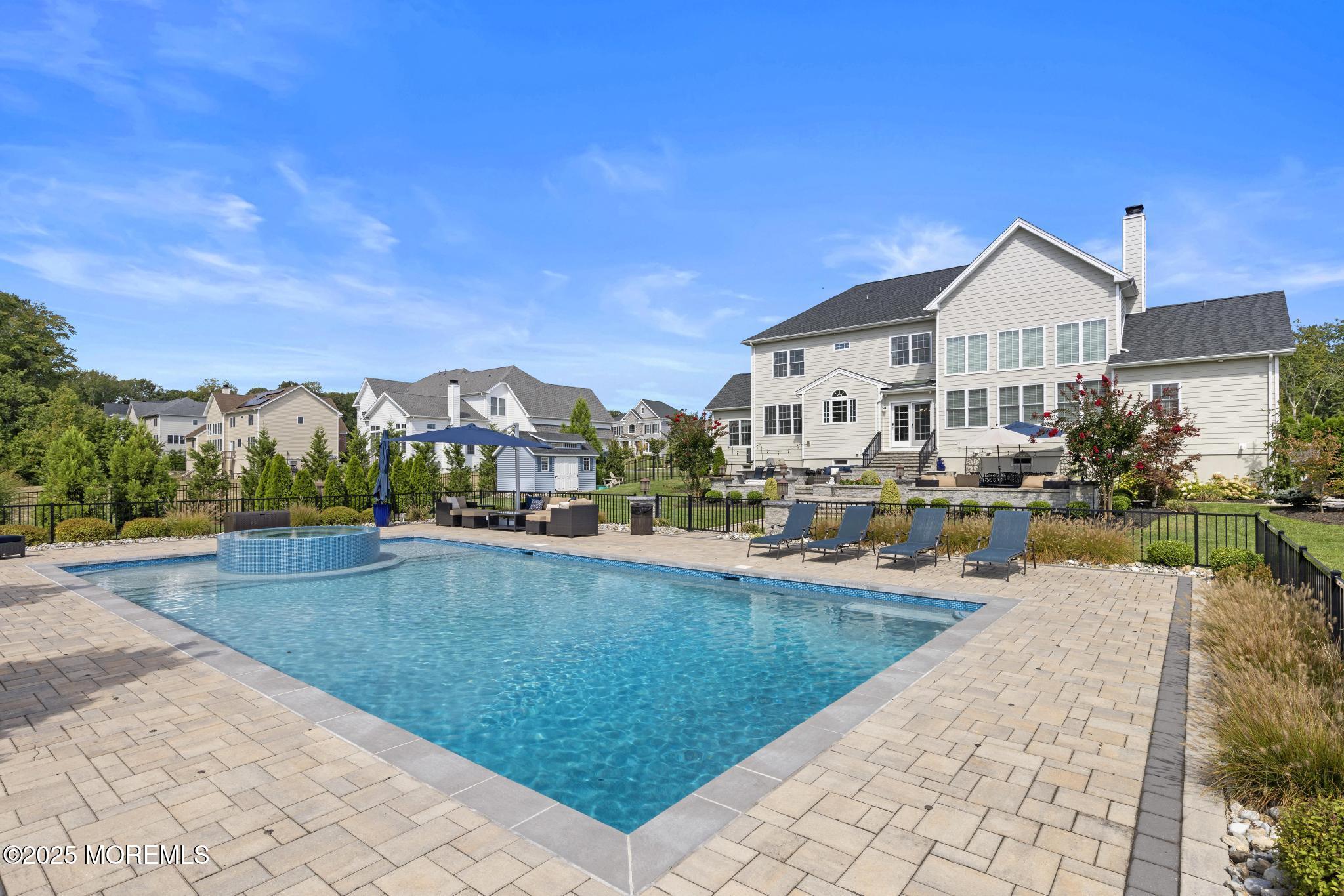 45 Windermere Road Lincroft, NJ 07738 - Photo 57 of 68 a view of a house with swimming pool and sitting area