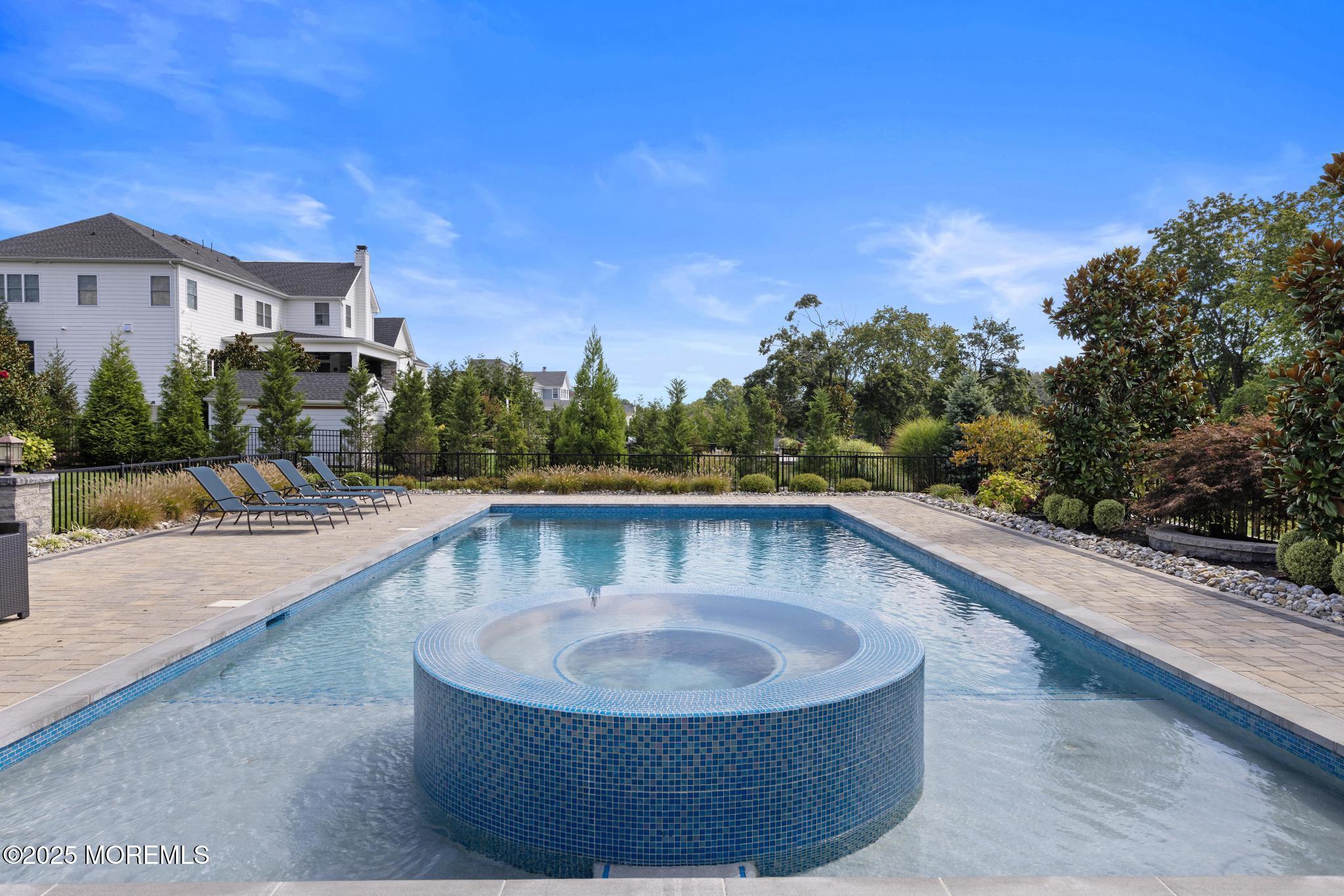 45 Windermere Road Lincroft, NJ 07738 - Photo 58 of 68 a view of swimming pool with outdoor seating and plants
