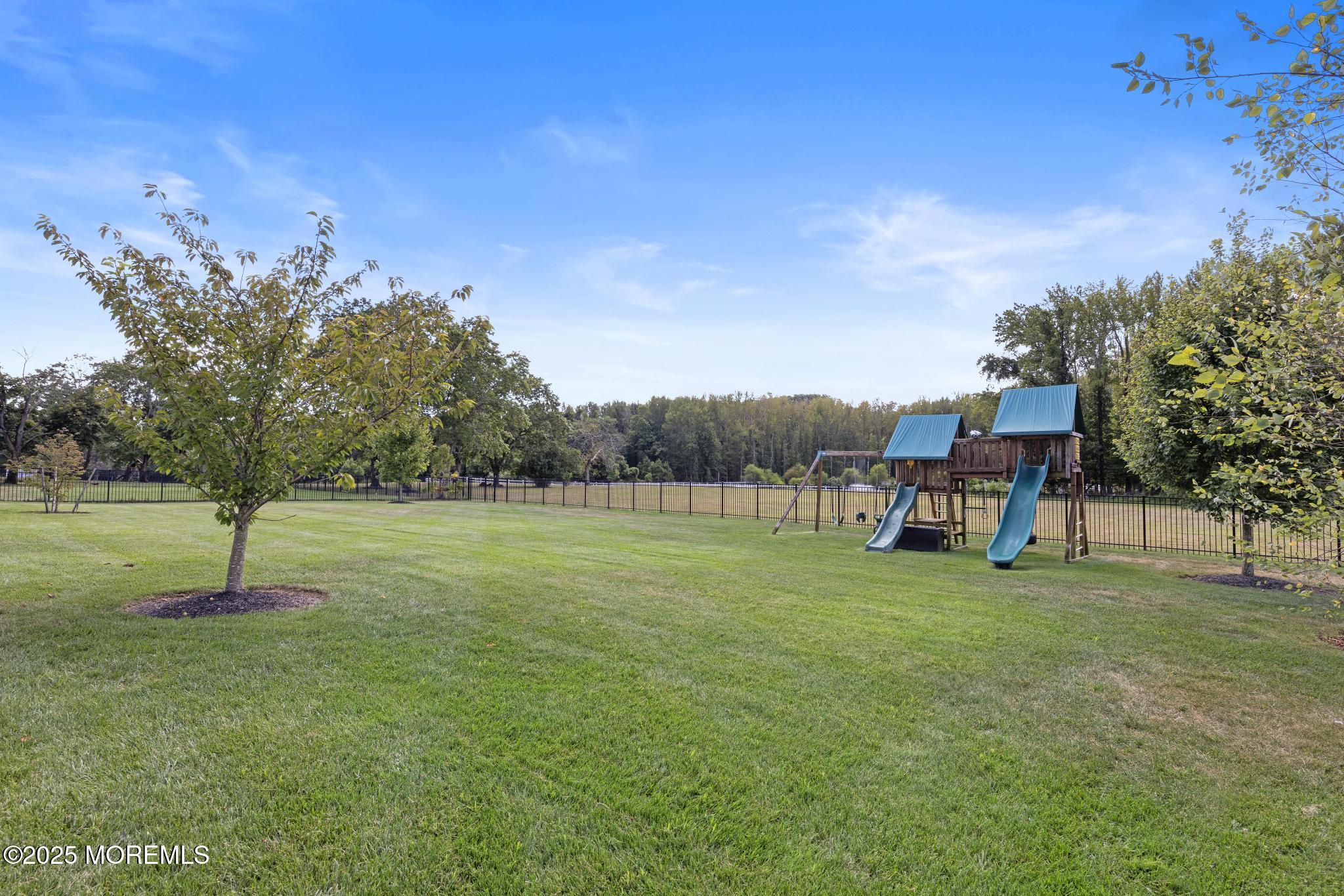 45 Windermere Road Lincroft, NJ 07738 - Photo 59 of 68 a view of a golf course with a park