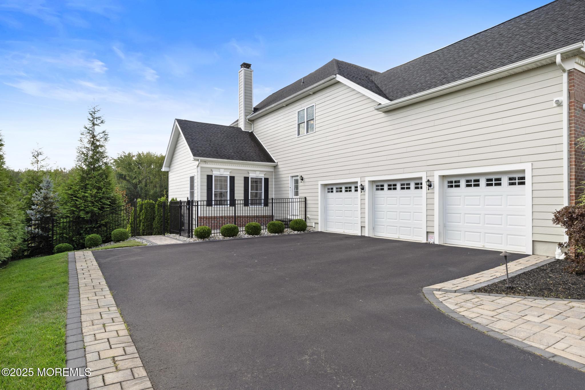 45 Windermere Road Lincroft, NJ 07738 - Photo 60 of 68 a front view of a house with a yard