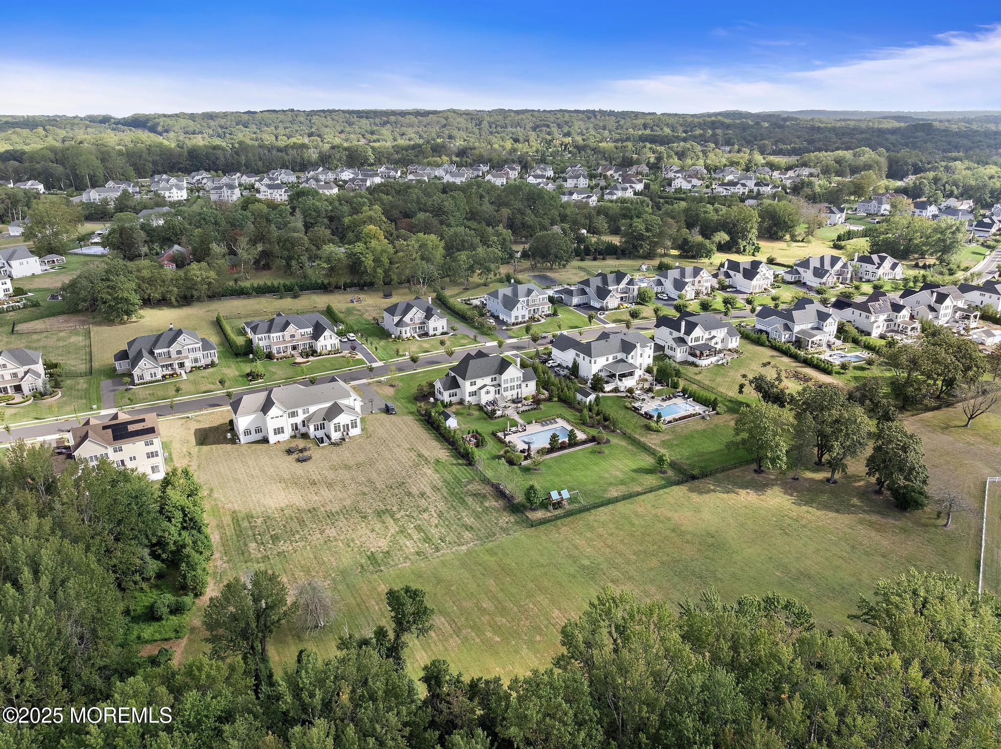 45 Windermere Road Lincroft, NJ 07738 - Photo 63 of 68 an aerial view of residential houses with outdoor space and trees