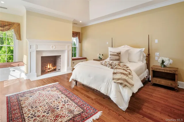a bed room with a bed and a fireplace