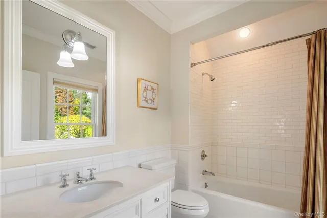 a bathroom with a sink a toilet and a bathtub