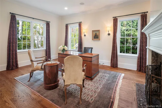 a living room with furniture a window and a fireplace