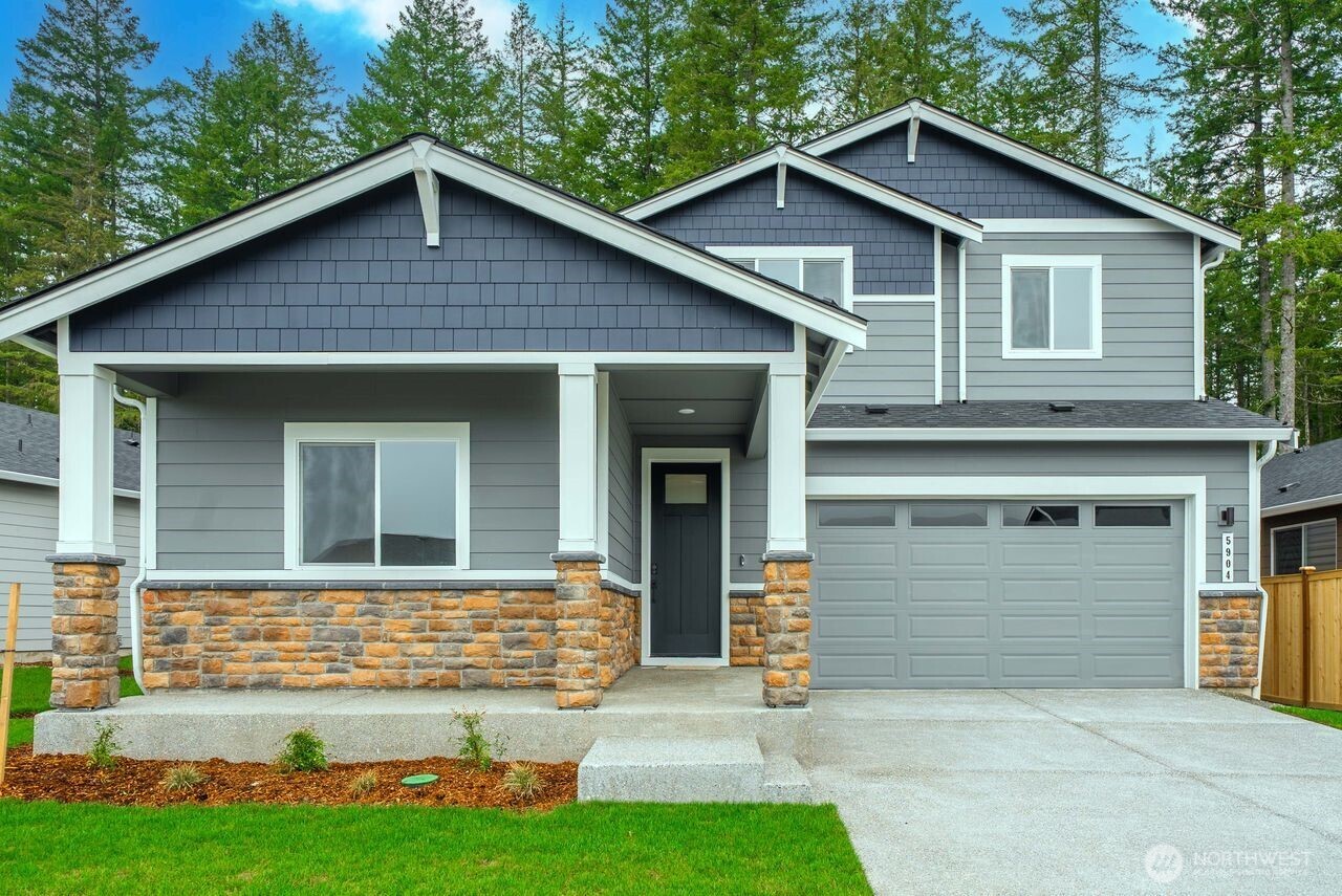 5904 Trce Drive Southwest Port Orchard, WA 98367 - Photo 3 of 29 a front view of a house with garden