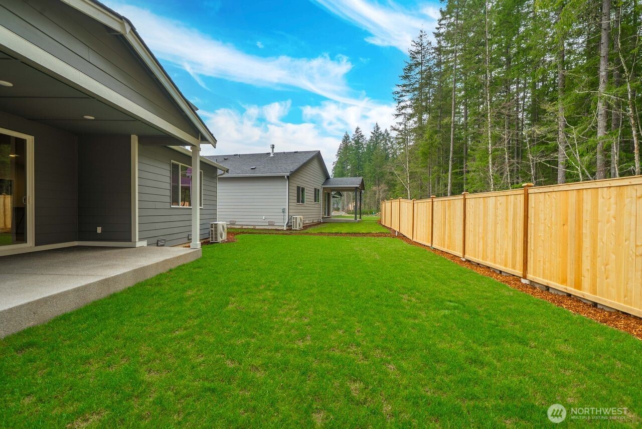 5904 Trce Drive Southwest Port Orchard, WA 98367 - Photo 4 of 29 a view of a house with backyard and porch