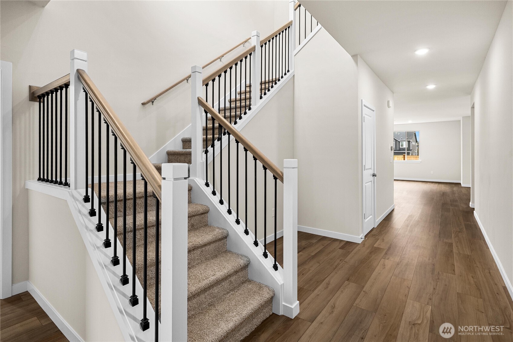 5904 Trce Drive Southwest Port Orchard, WA 98367 - Photo 7 of 29 a view of staircase with wooden floor and white walls