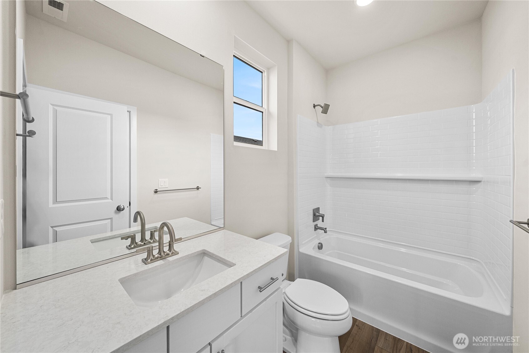 5904 Trce Drive Southwest Port Orchard, WA 98367 - Photo 9 of 29 a bathroom with a sink toilet vanity and tub