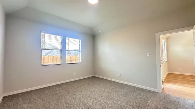 an empty room with closet area