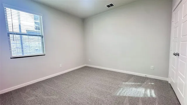 a bathroom with a double vanity sink mirror and shower