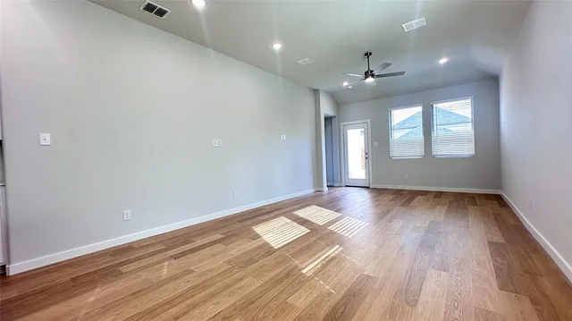 a kitchen with a sink window and cabinets