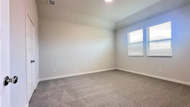 a kitchen with stainless steel appliances a sink a stove a microwave and cabinets