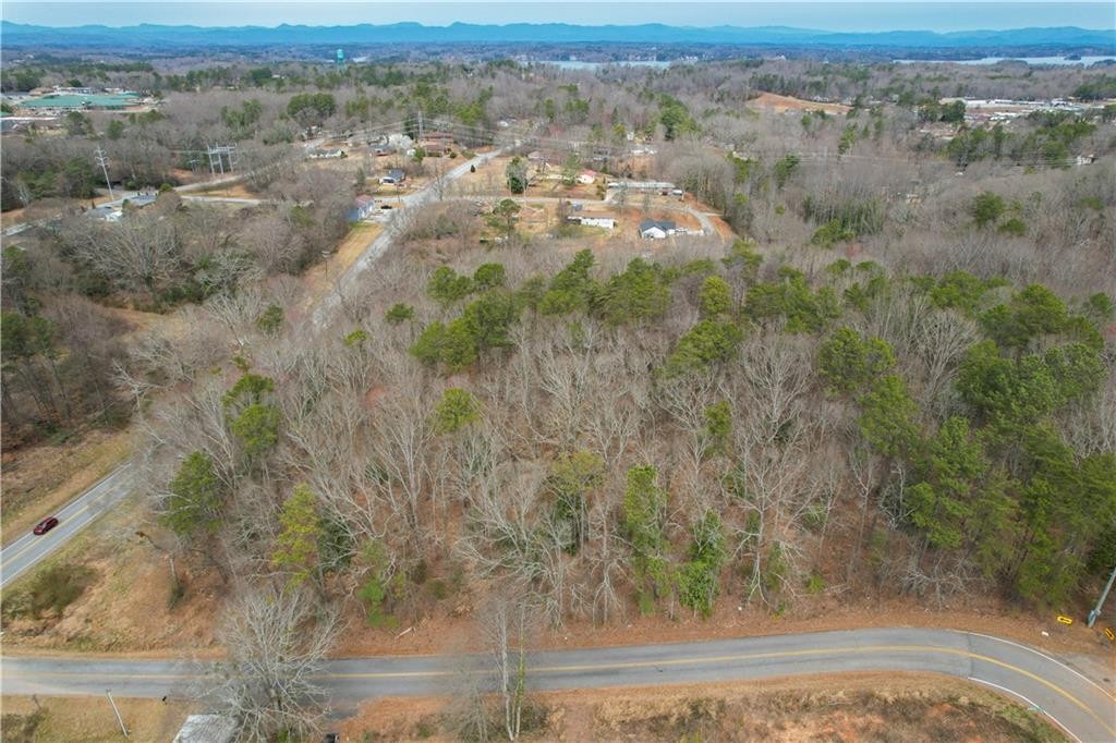 0 North Walnut Street Seneca, SC 29678 - Photo 5 of 12 Discover a tranquil, tree-lined landscape with distant community views and winding roads for peaceful living.