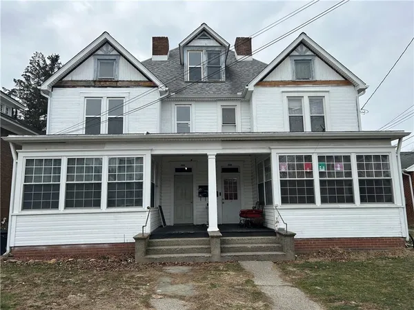 a view of a large house with large windows