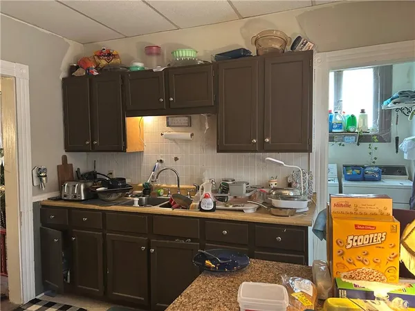 a kitchen with a sink and cabinets