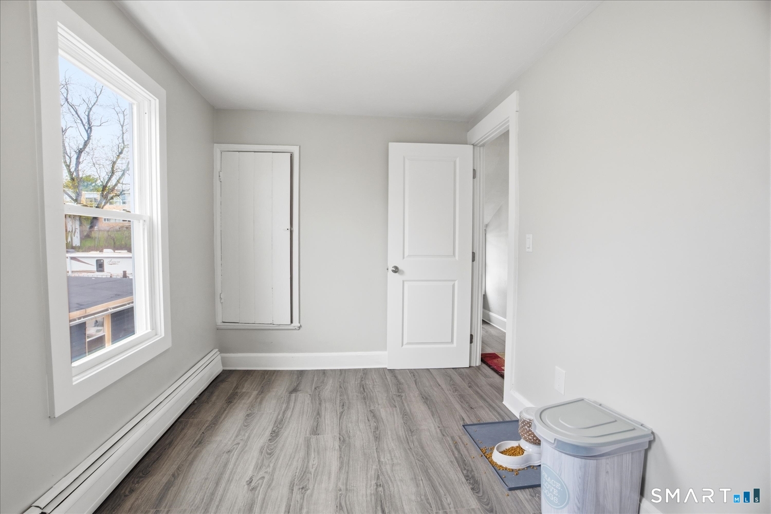 67 Pomfret Street Putnam, CT 06260 - Photo 17 of 25 a view of a room with wooden floor and small window