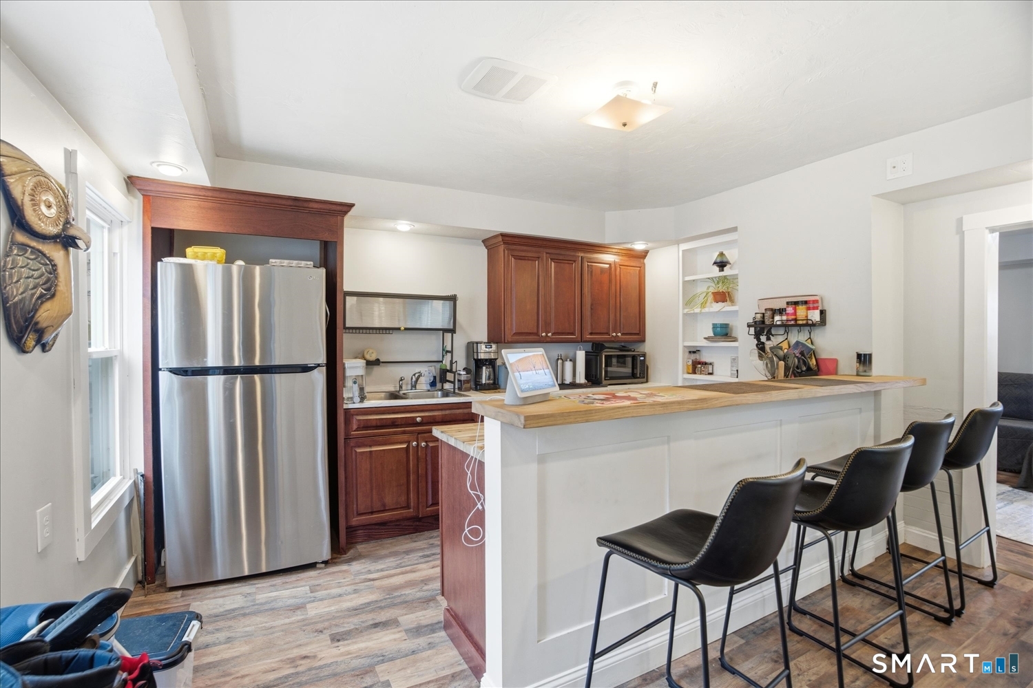 67 Pomfret Street Putnam, CT 06260 - Photo 4 of 25 a kitchen with stainless steel appliances a refrigerator and a stove top oven