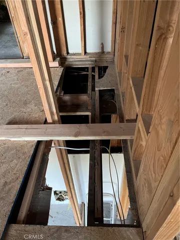 a view of a porch with a table and chairs