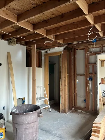 a living room with a couch and a table and potted plant