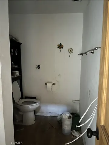 a bathroom with a toilet and a sink