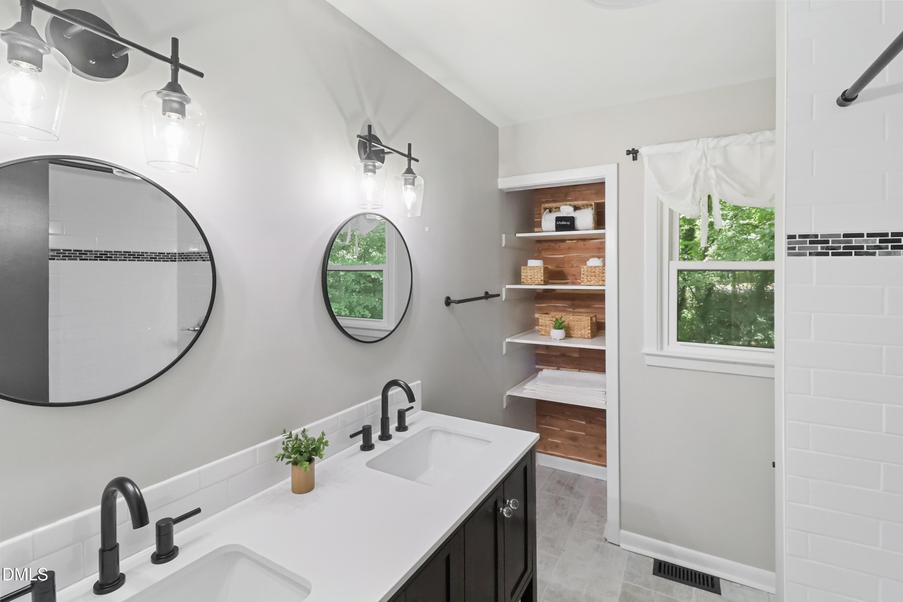 115 Bertie Drive Raleigh, NC 27610 - Photo 13 of 27 a bathroom with a sink and a mirror