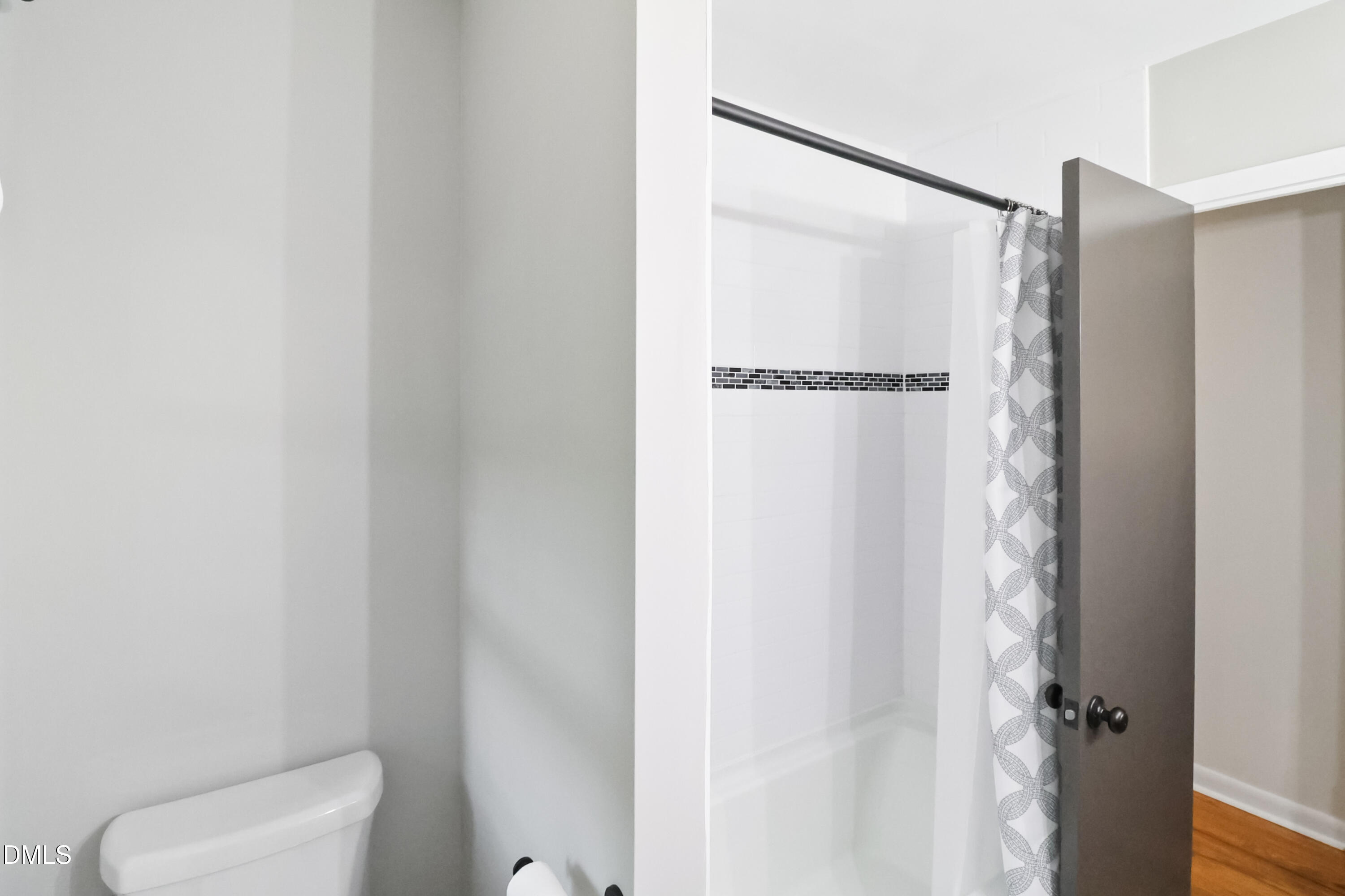 115 Bertie Drive Raleigh, NC 27610 - Photo 14 of 27 a bathroom with a shower and a toilet