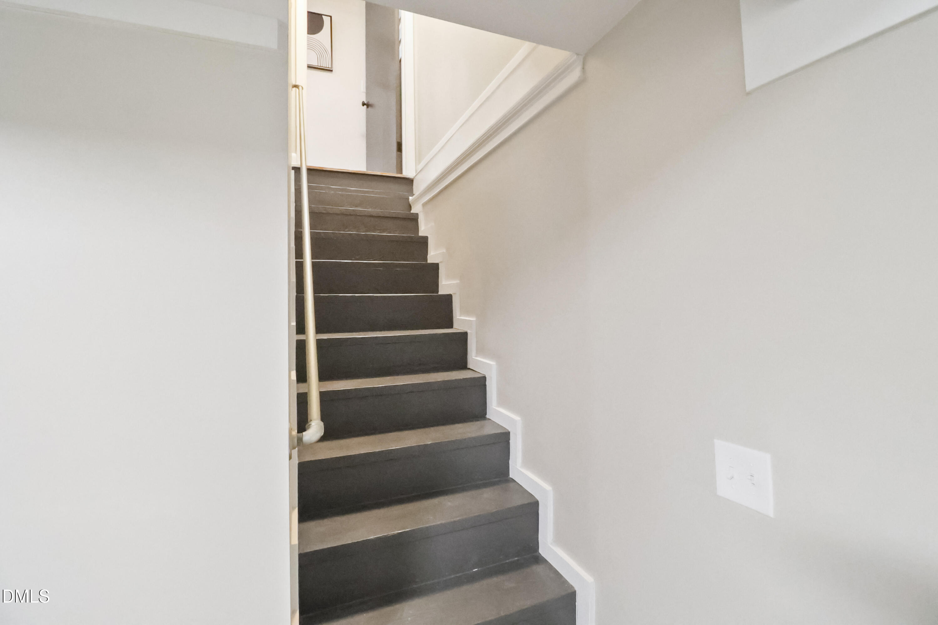 115 Bertie Drive Raleigh, NC 27610 - Photo 15 of 27 a view of staircase with white walls