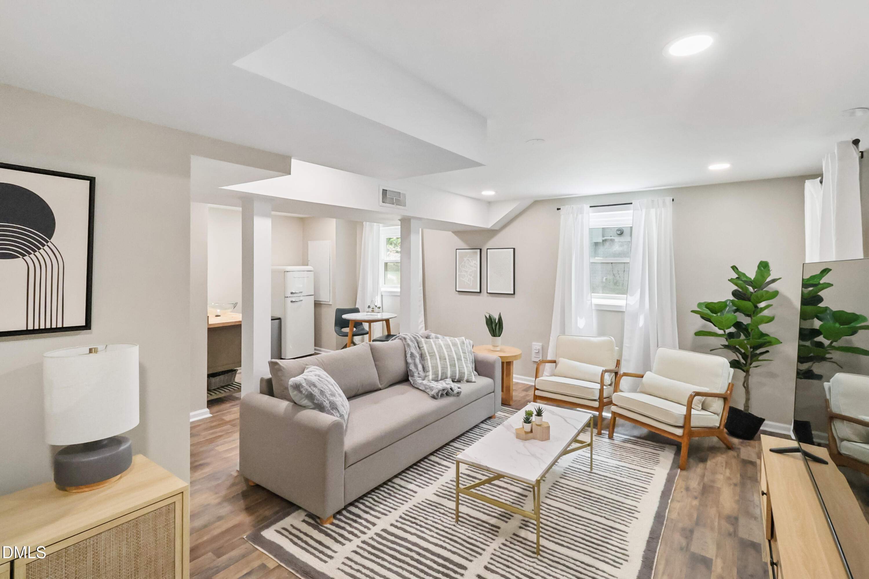 115 Bertie Drive Raleigh, NC 27610 - Photo 18 of 27 a living room with furniture and a potted plant