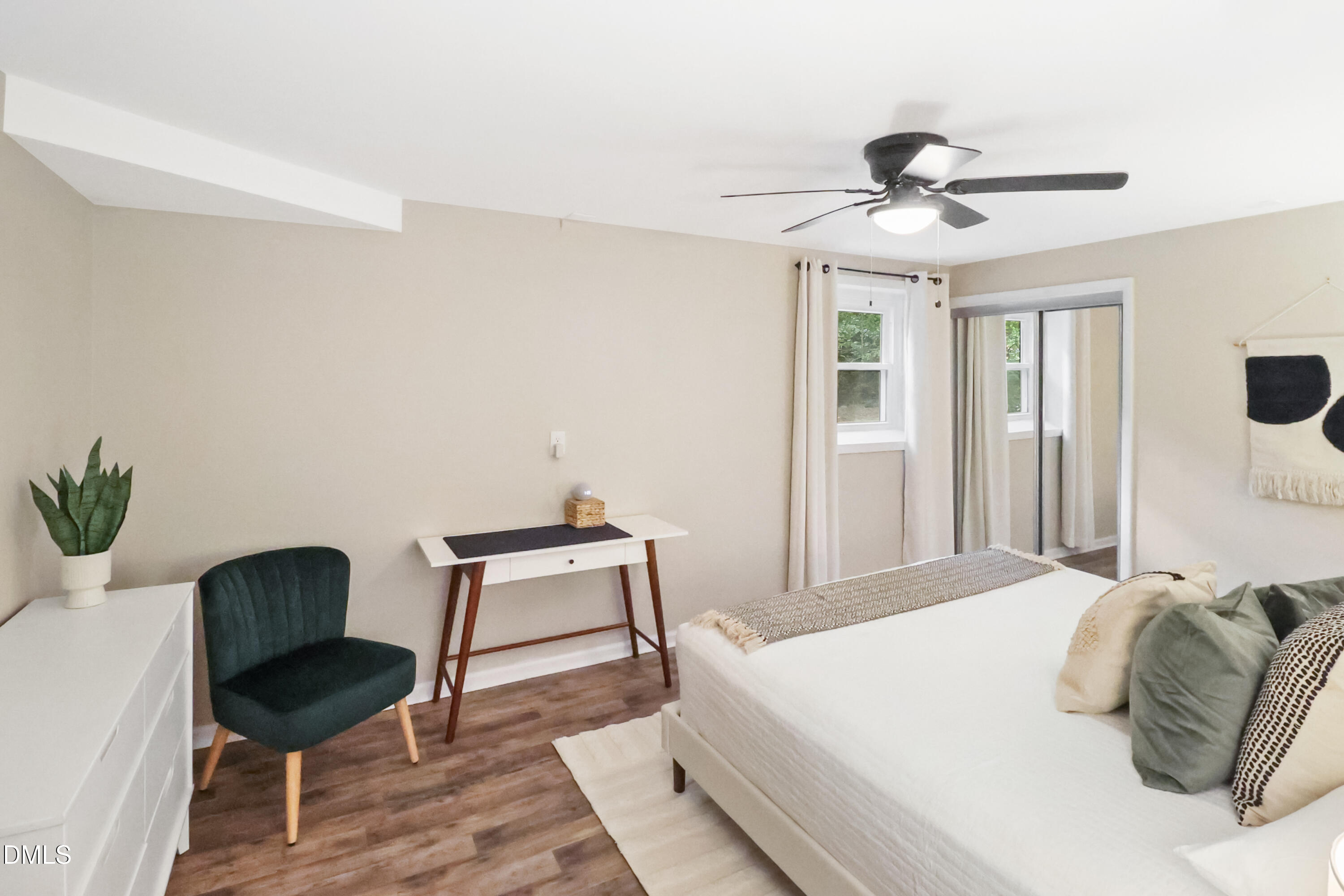 115 Bertie Drive Raleigh, NC 27610 - Photo 19 of 27 a bedroom with a bed and a chair