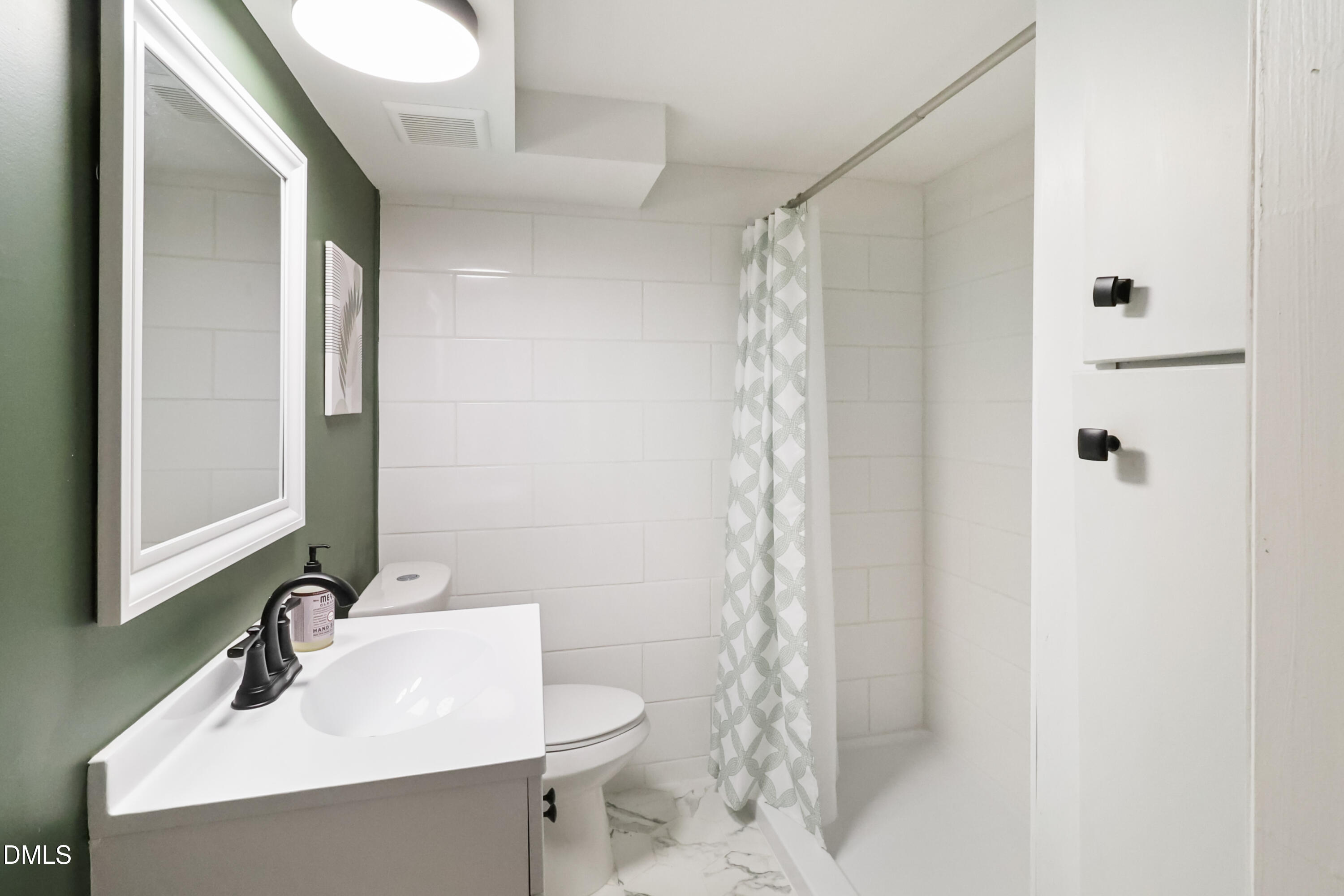115 Bertie Drive Raleigh, NC 27610 - Photo 20 of 27 a bathroom with a sink toilet and shower