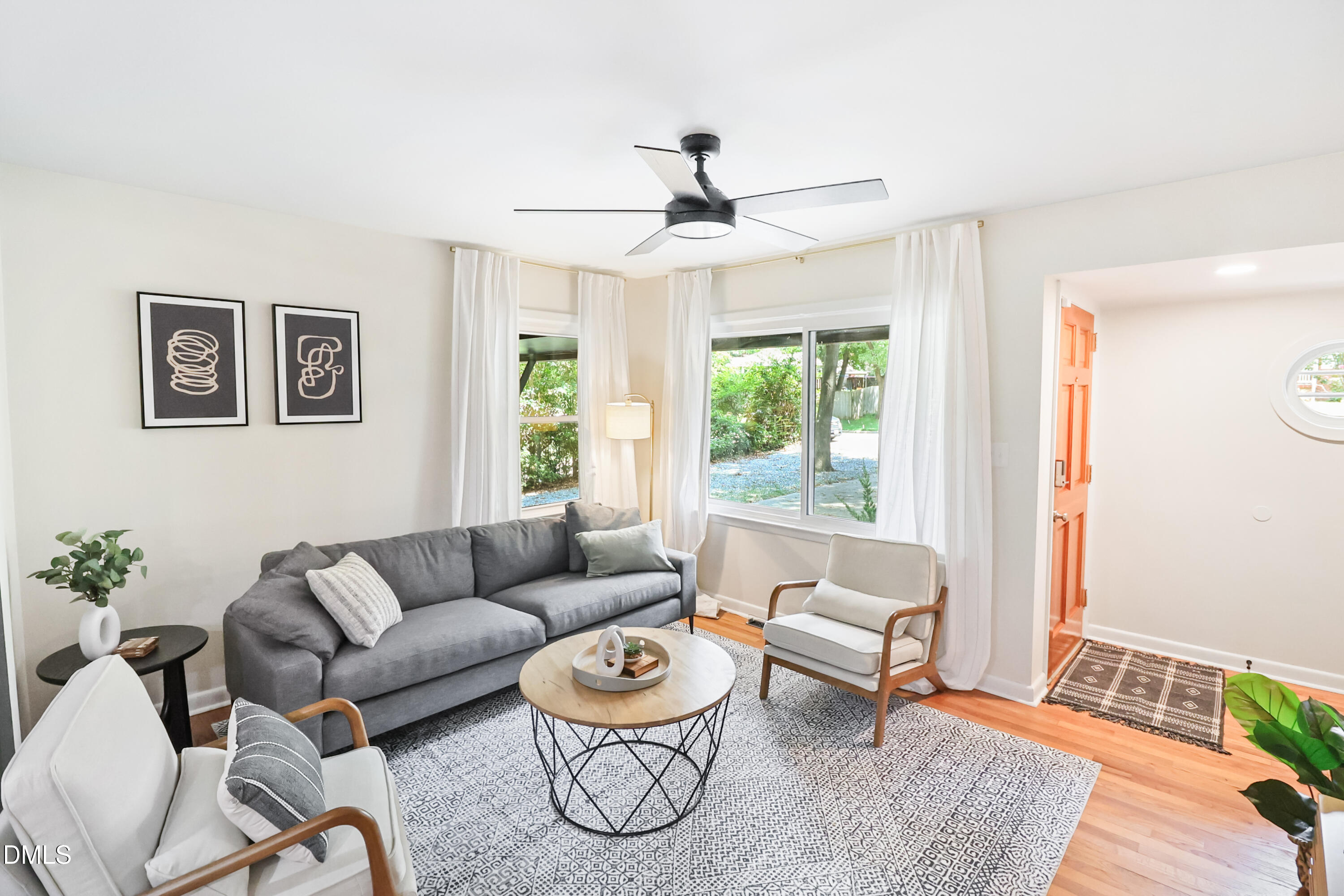 115 Bertie Drive Raleigh, NC 27610 - Photo 5 of 27 a living room with furniture and a window
