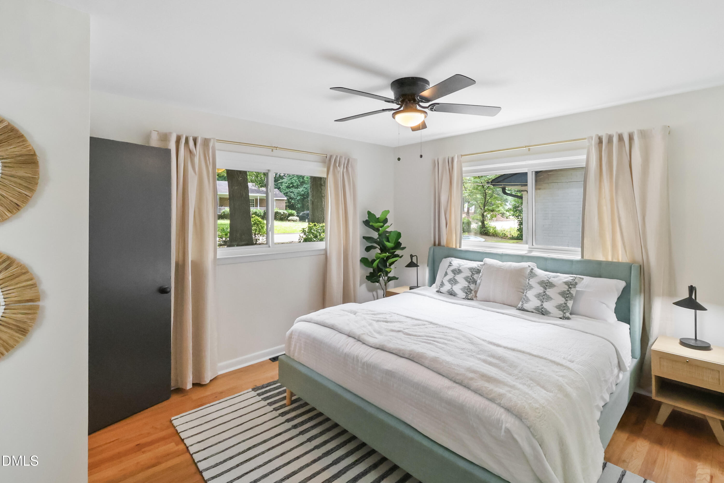 115 Bertie Drive Raleigh, NC 27610 - Photo 10 of 27 a bedroom with a large bed and a window