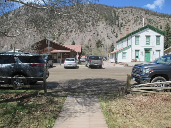 a view of a car park in front of a house