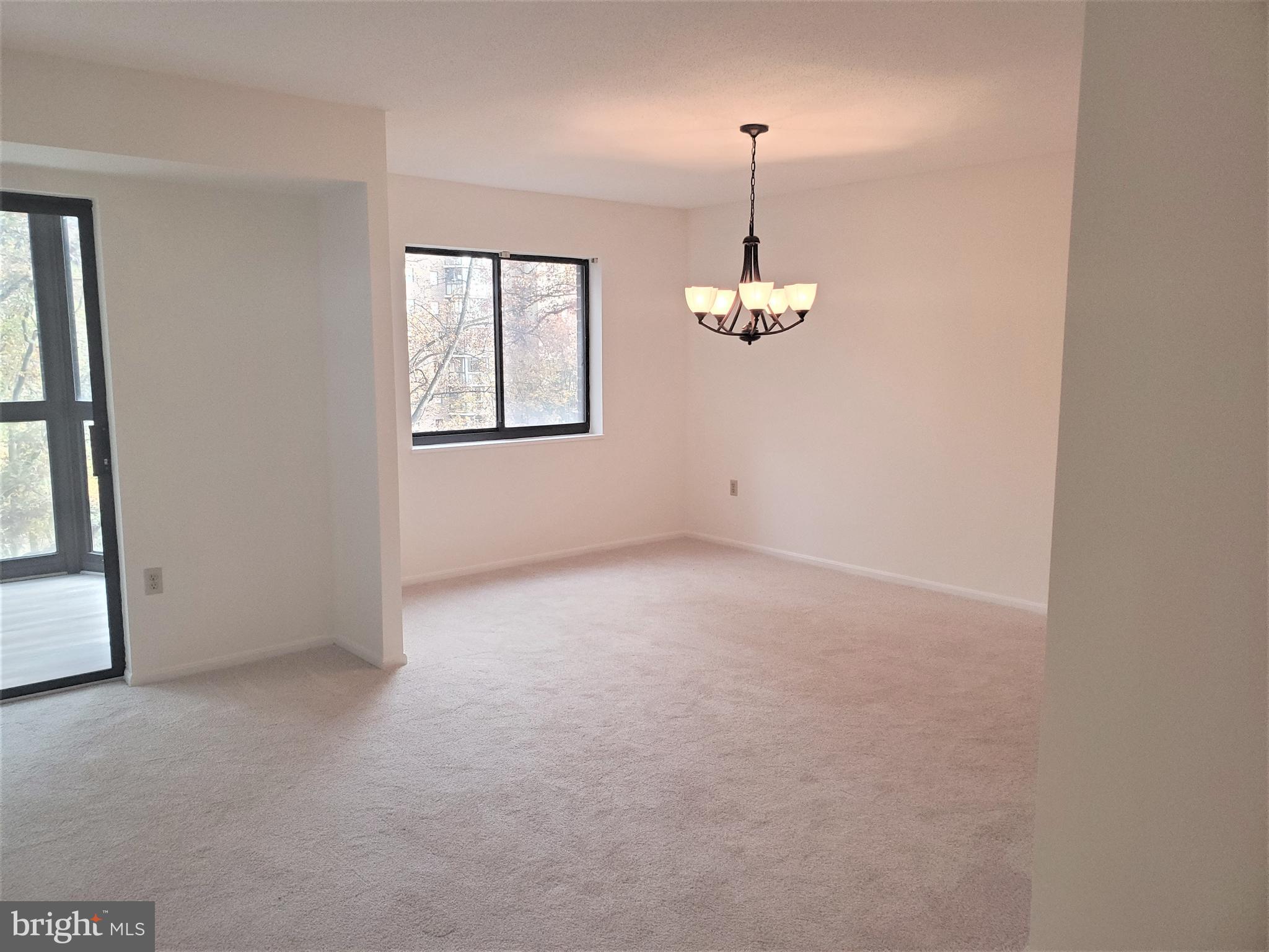 15100 Interlachen Drive, Unit 4516 Silver Spring, MD 20906 - Photo 4 of 28 Living Room Adjoins Dining Room