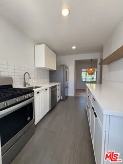 a bathroom with a tub sink and window