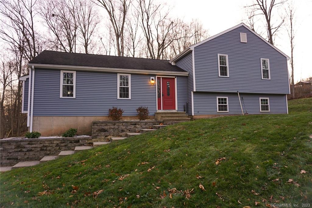 51 Mack Road Middlefield, CT 06455 - Photo 1 of 1 a brick house with a yard