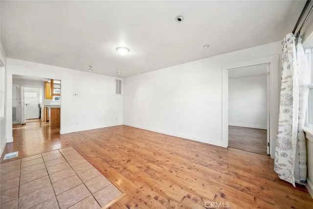 a view of empty room with windows