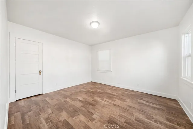 a view of a house with a yard and a wooden deck