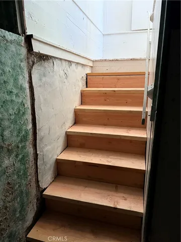 a view of a livingroom with a ceiling fan and window