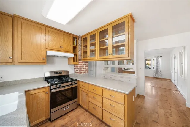 a view of an empty room and wooden floor