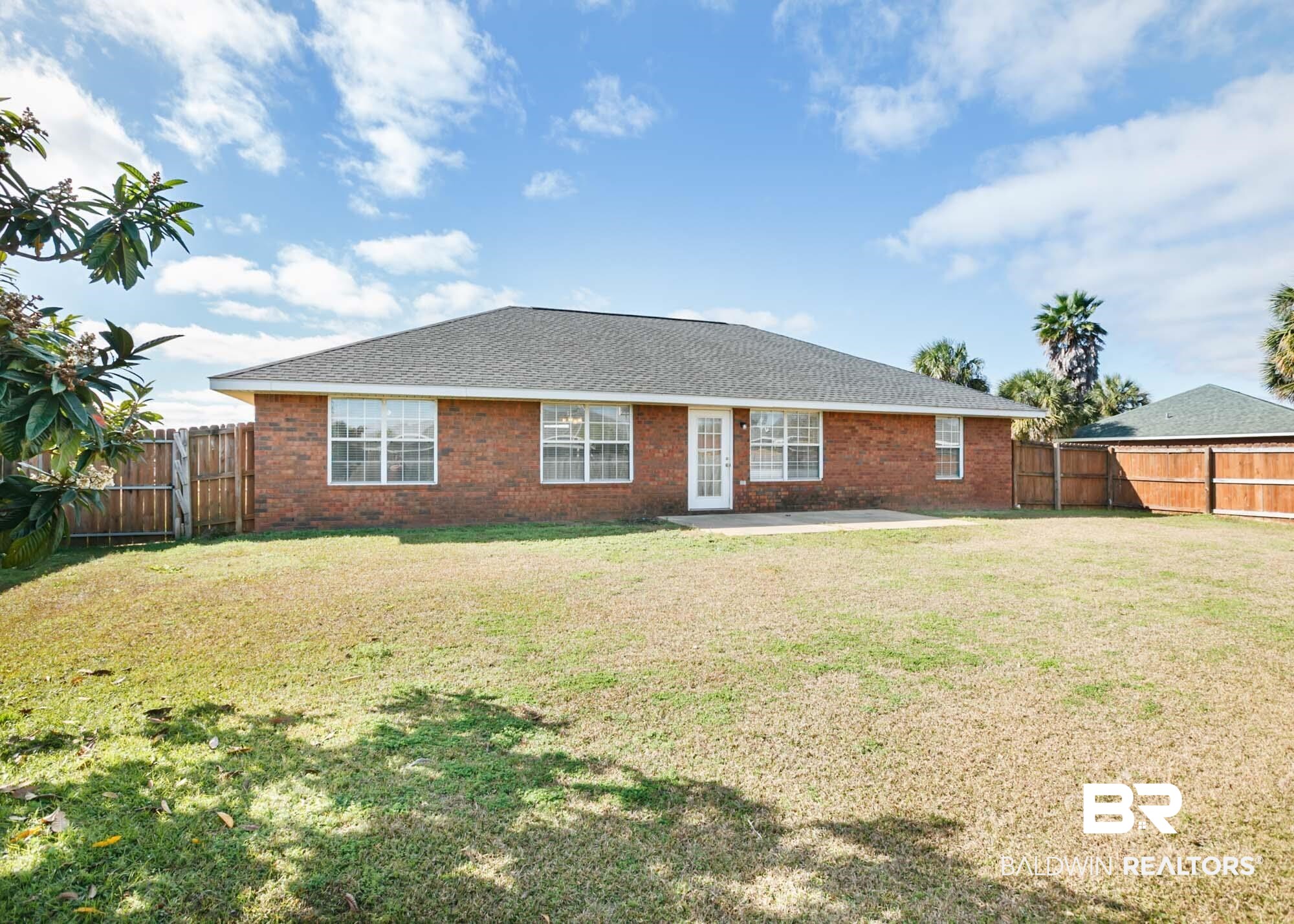2530 Ashburn Lane Foley, AL 36535 - Photo 6 of 46 View of front facade with a patio area and a front lawn