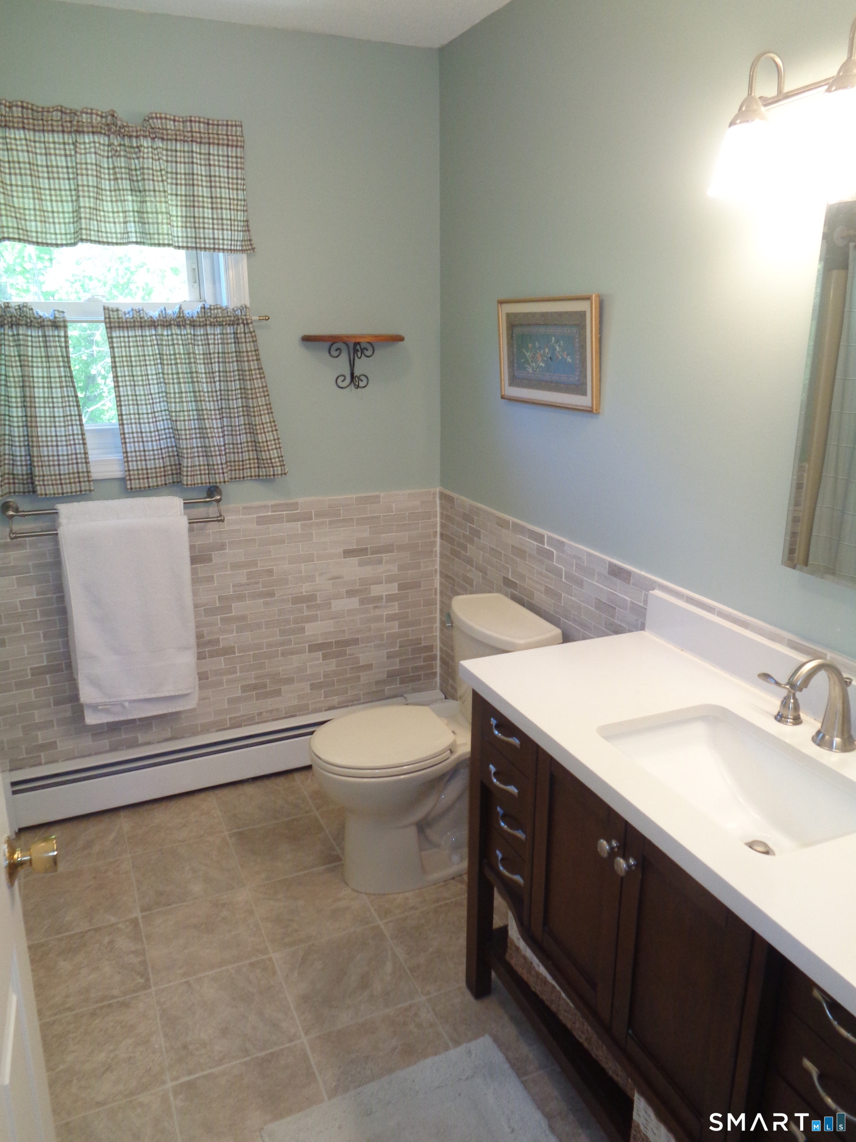 321 Spring Street Naugatuck, CT 06770 - Photo 8 of 27 a bathroom with a sink a toilet and tub