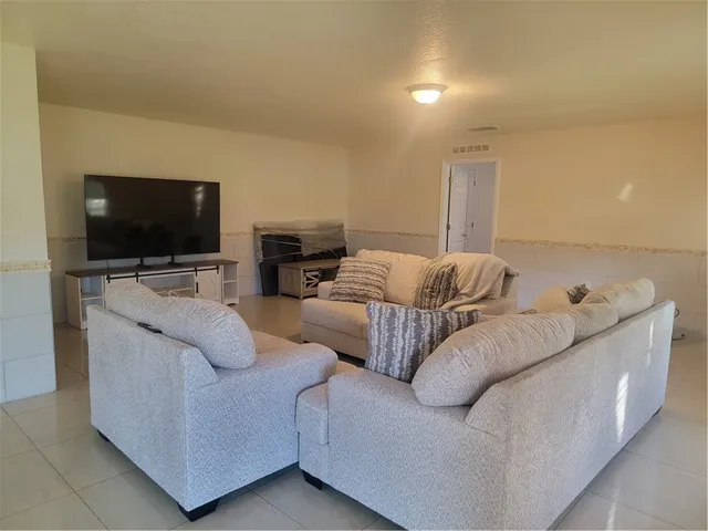 a bathroom with a bathtub sink and mirror