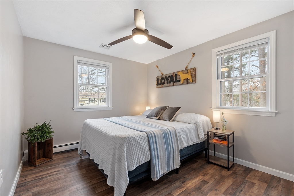 16 Michael Road Maynard, MA 01754 - Photo 13 of 39 a bedroom with a bed wall painting and a window