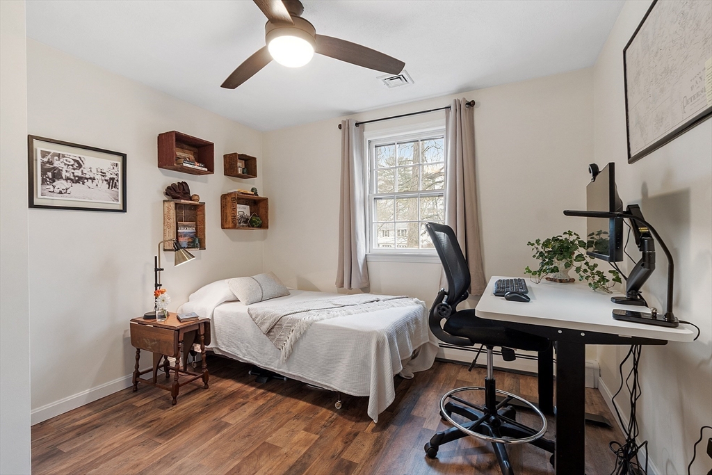 16 Michael Road Maynard, MA 01754 - Photo 14 of 39 a bedroom with a bed and a table in it