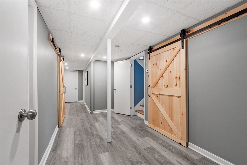 16 Michael Road Maynard, MA 01754 - Photo 17 of 39 a view of hallway with wooden floor and staircase