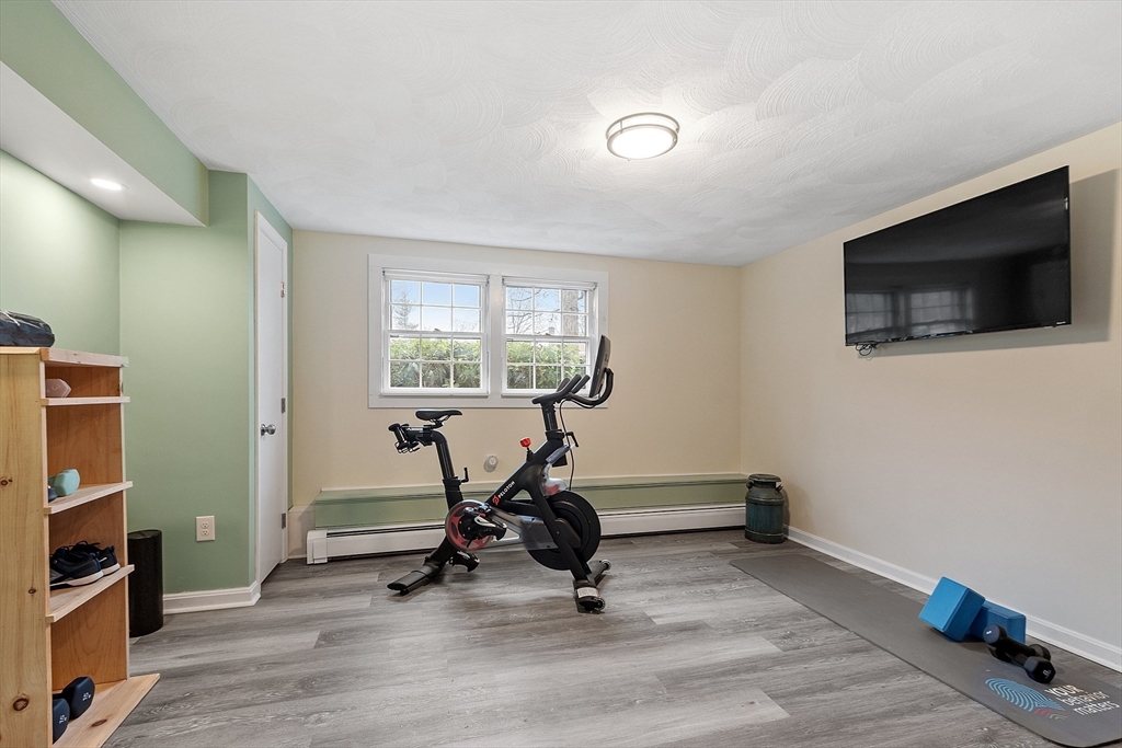 16 Michael Road Maynard, MA 01754 - Photo 21 of 39 a view of a livingroom with gym equipment
