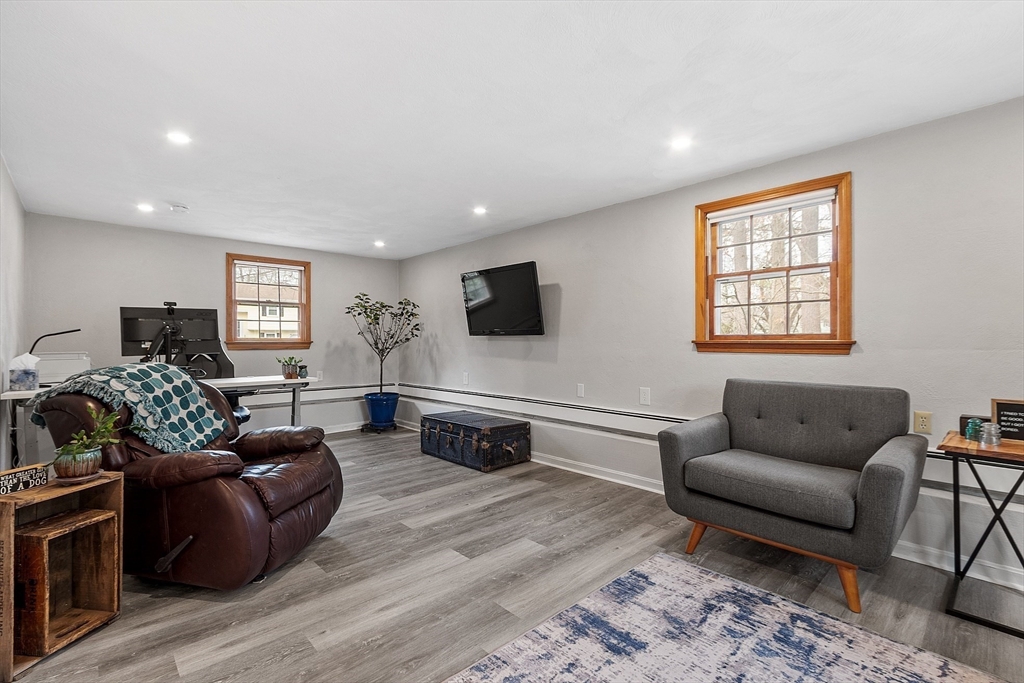 16 Michael Road Maynard, MA 01754 - Photo 23 of 39 a living room with furniture flat screen tv and wooden floor